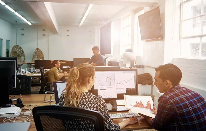 Young business professionals working in an office.