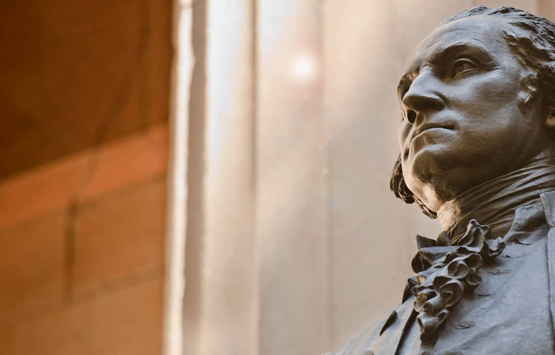 Statue in front of financial institution.