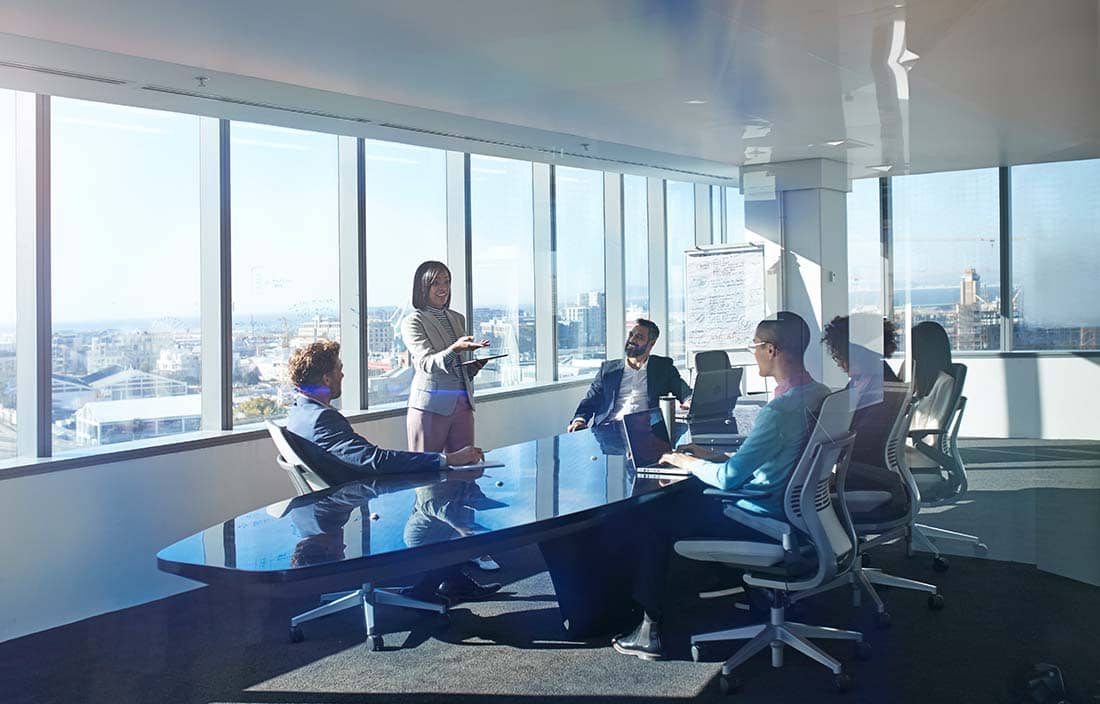Business professionals meeting in a conference room.