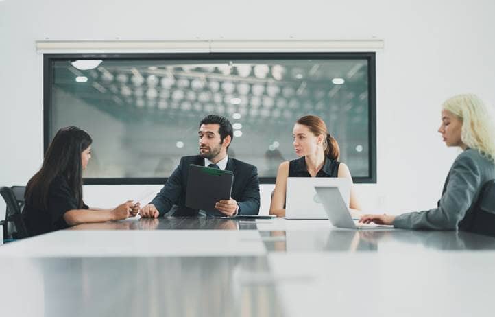 International business professionals in a modern conference room.