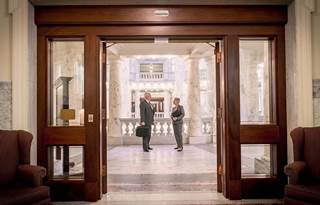 Man and woman standing in a lobby
