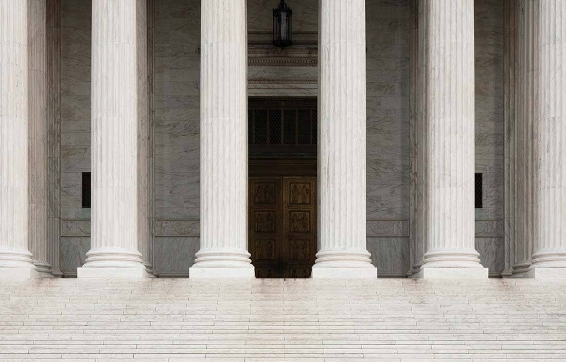 View of a government building with columns.