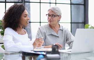Two public sector professionals discussing Uniform Guidance audit changes.