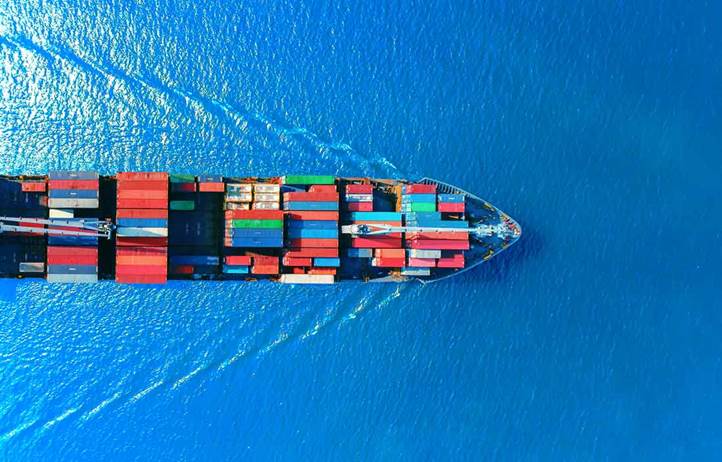 Cargo ship sailing through the ocean.
