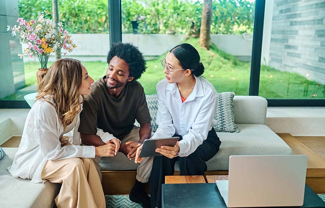 Family talking about estate planning in their living room.