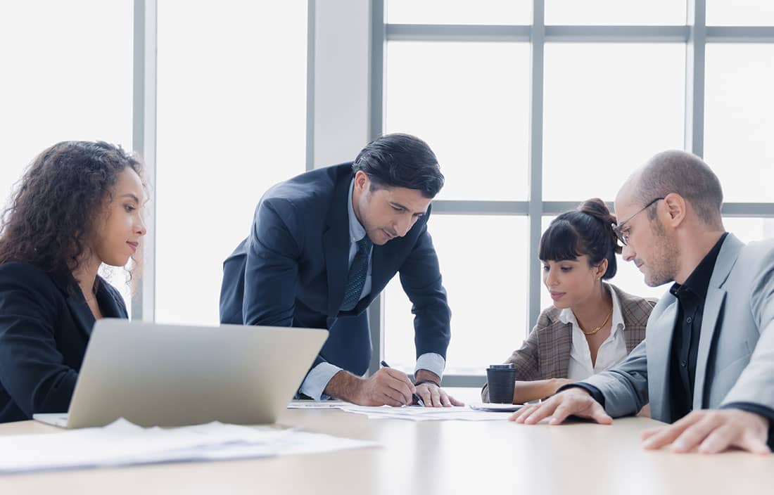 Cybersecurity professionals in a modern conference room.
