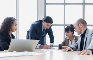 Cybersecurity professionals in a modern conference room.