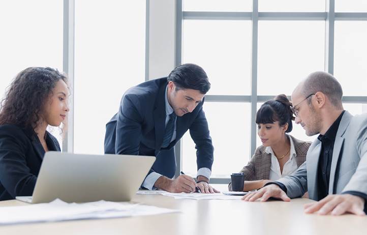 Cybersecurity professionals in a modern conference room.