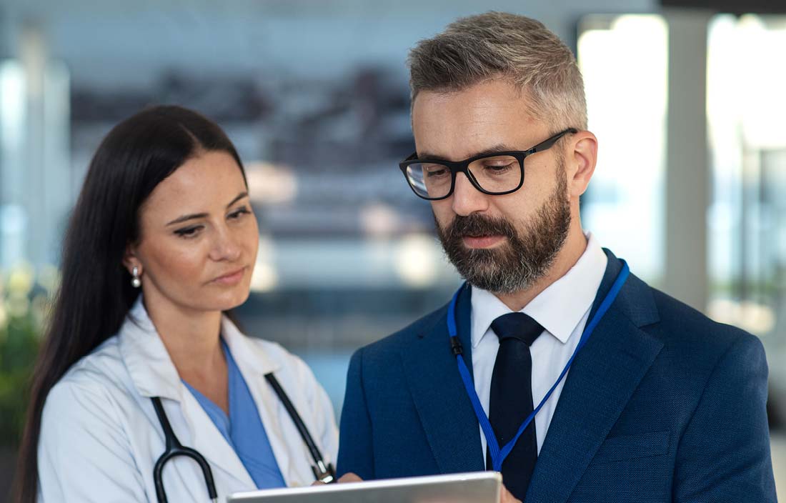 Doctor and healthcare professional talking to each other.