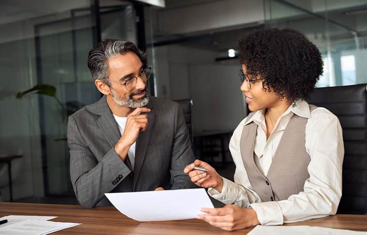 Financial advisor talking to their client.