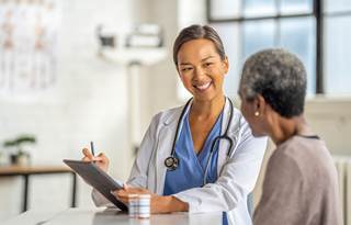 Healthcare professional talking to their patient.