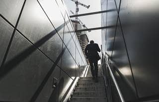 Person walking up stairs.