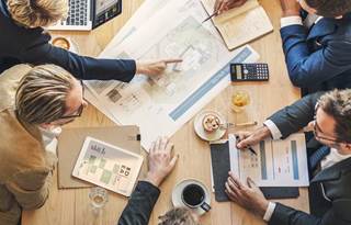 Aerial view of business professionals in a meeting.