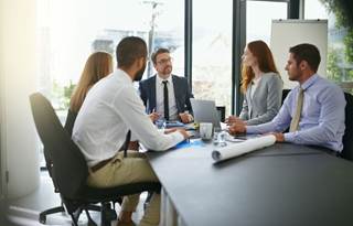 Health and welfare plan advisors in a meeting.