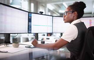 Banking professional working on their computers.