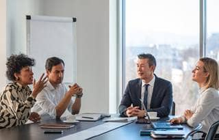 Automotive professionals in a meeting.