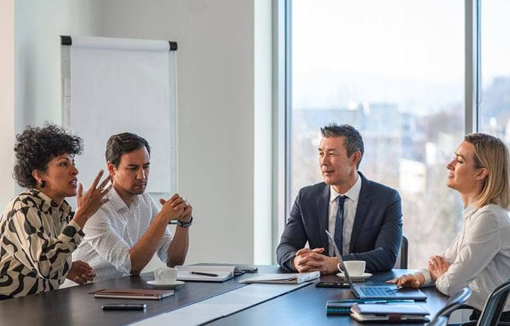 Automotive professionals in a meeting.