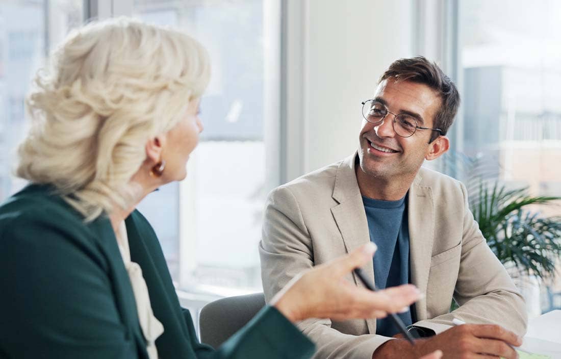 Financial advisor speaking to their client.