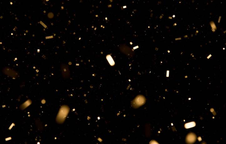 Confetti against a black background.