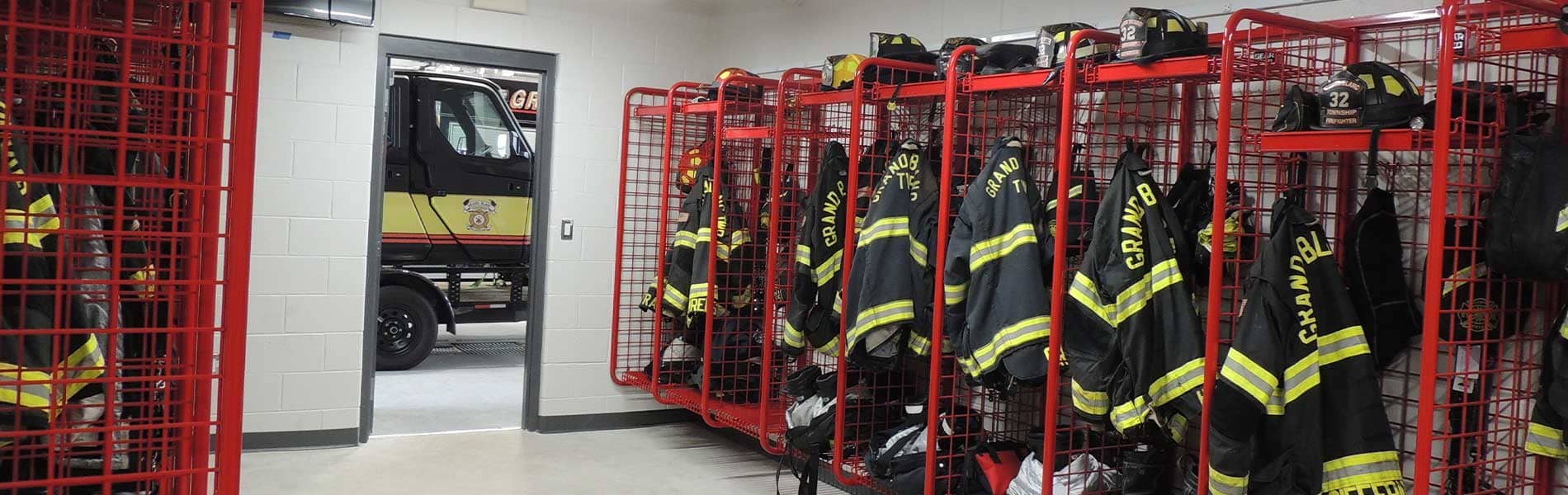 Interior of fire station with firefighter jackets.