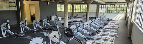 University of Michigan Rowing Association new location's interior showing rowing machines